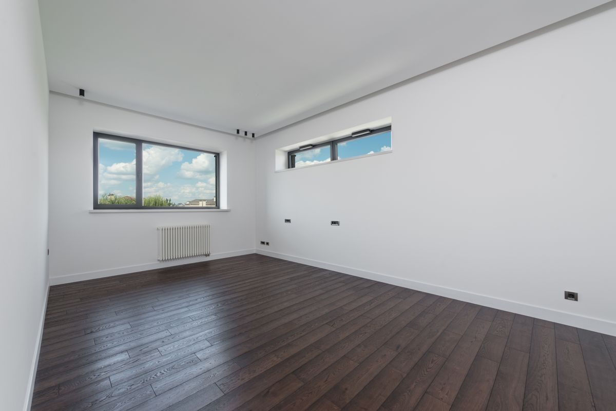 Modern room with wide-plank vinyl flooring and large windows
