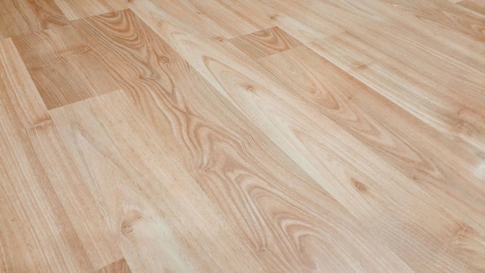 Light linen-oak vinyl plank flooring texture